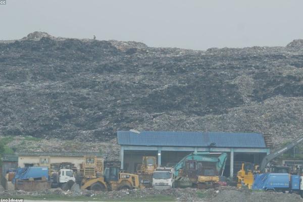 Landfill site with machinery